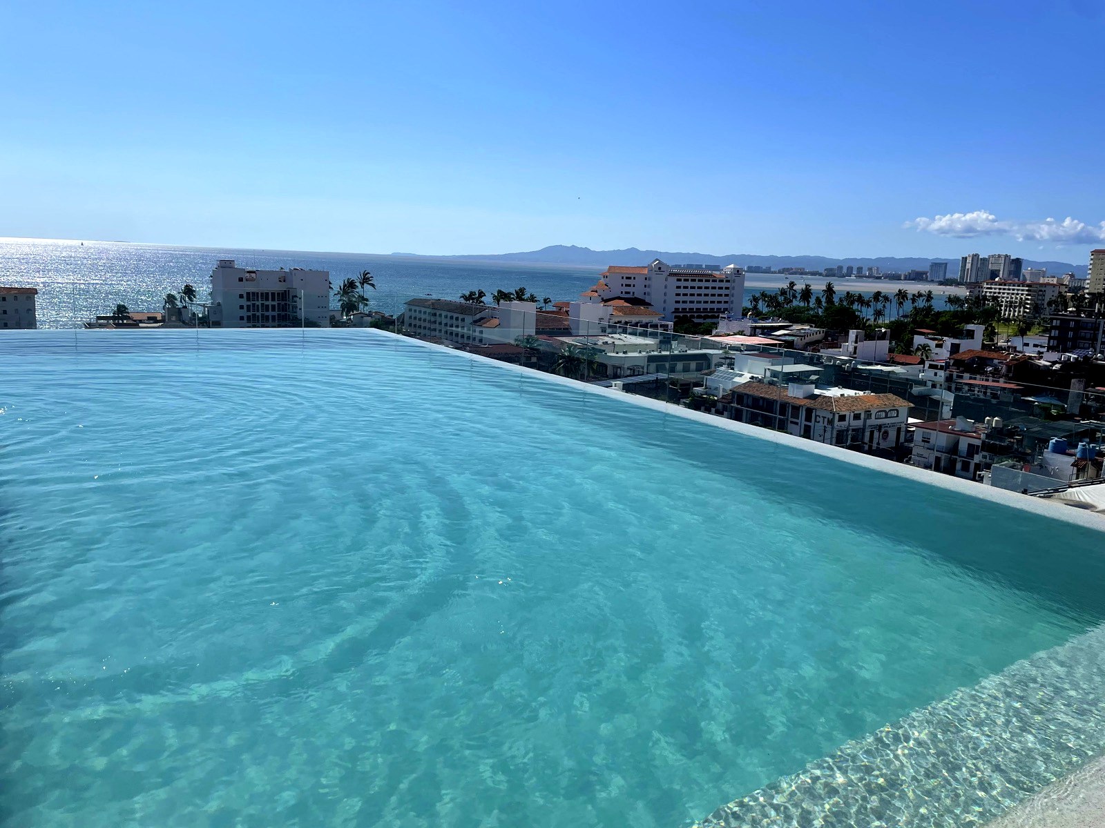 Rooftop infinity pool with panoramic bay view — Oporto 405, Puerto Vallarta