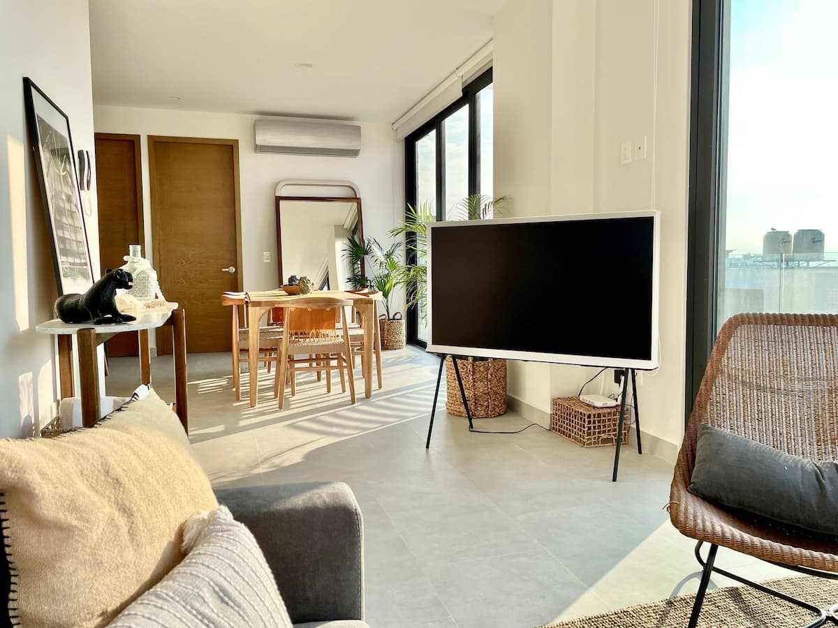 Furnished living room with dining table — Oporto 405 condo for rent